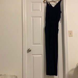 Navy blue jumpsuit with tie waist and gold detail